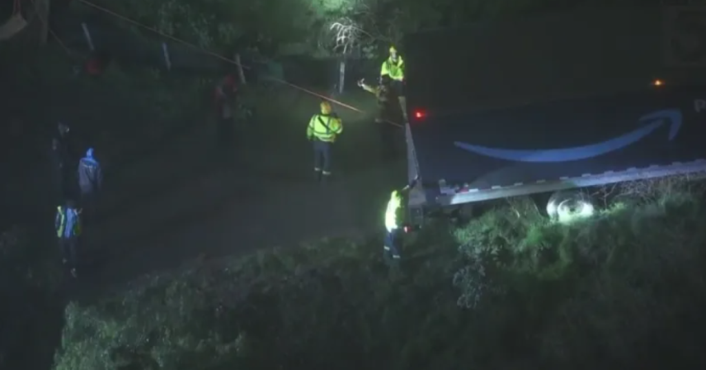 Amazon truck hangs on hillside, threatening home below - Los Angeles Times