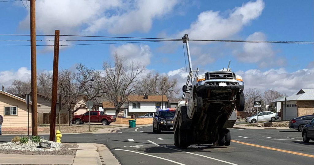 Truck caught in telecom lines close N. 11th Avenue in Brighton - CBS Colardo