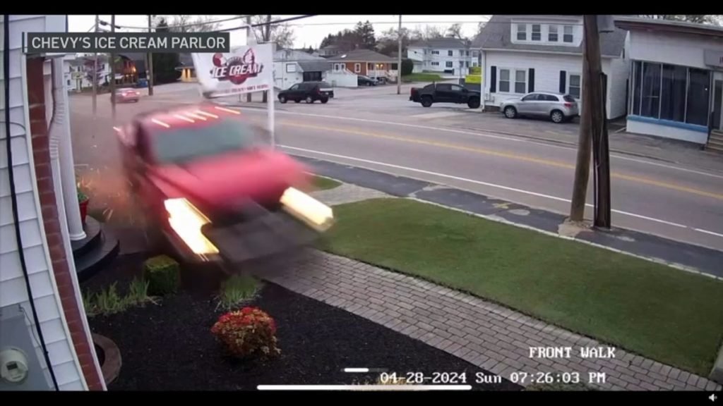 WATCH: Out-of-control truck slams into sign, narrowly avoids car with woman and baby inside - NBC Boston