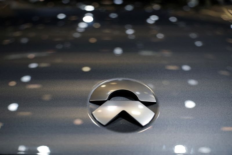 FILE PHOTO: A logo of Nio is pictured on its car at the Beijing International Automotive Exhibition, or Auto China 2024, in Beijing, China, April 25, 2024. REUTERS/Tingshu Wang/File Photo