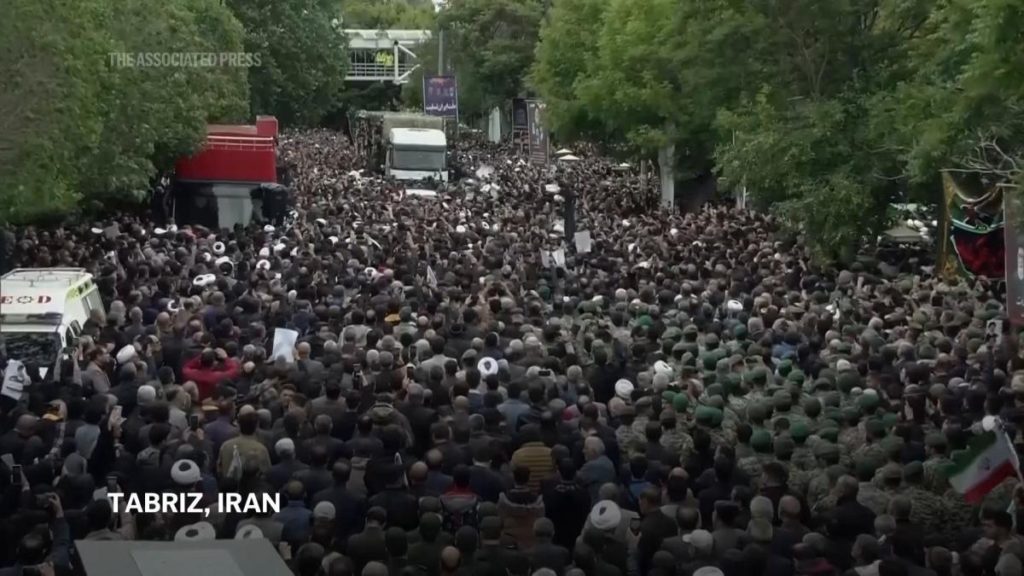 Crowd of mourners surrounds truck carrying remains of Iran president and officials killed in chopper crash - Yahoo! Voices