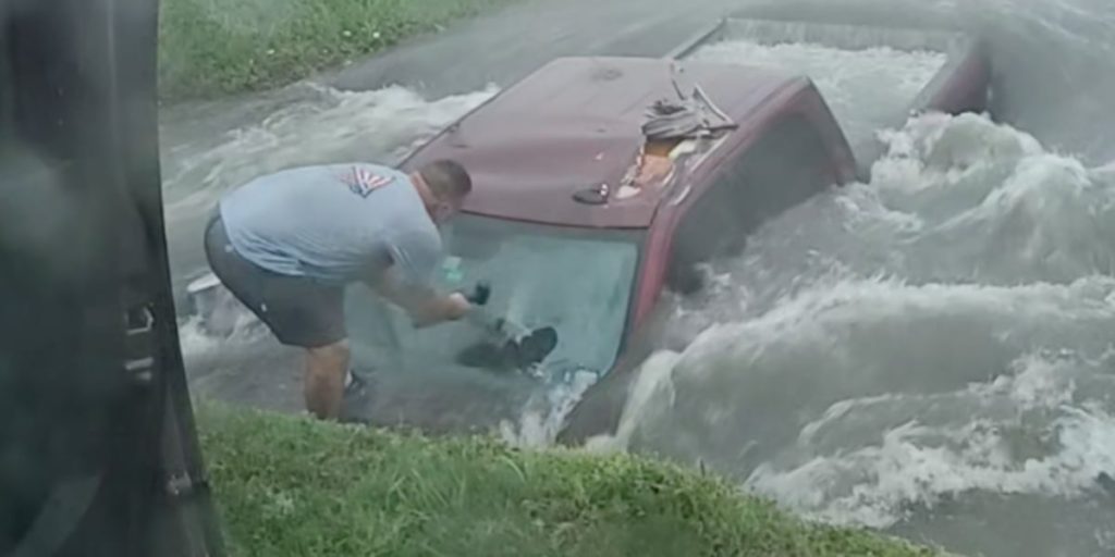 Dramatic video shows Texas couple breaking windshield to save man whose truck was being swallowed in flooded ditch - KWTX