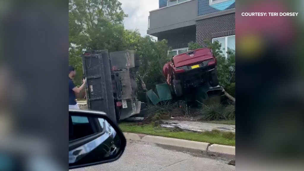 Dallas crash video shows red pickup, utility truck in bushes - WFAA.com