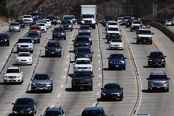 Cars, trucks, SUVs, and other vehicles drive in traffic on the 405 freeway through the Sepulveda Pass in Los Angeles, California, on August 25, 2022. - California ruled Thursday that all new cars sold in America's most populous state must be zero emission from 2035, in what was billed as a "nation-leading" step to slash the pollutants that cause global warming. (Photo by Patrick T. FALLON / AFP) / The erroneous mention[s] appearing in the metadata of this photo by Patrick T. FALLON has been modified in AFP systems in the following manner: [Los Angeles, California] instead of [Santa Monica, California]. Please immediately remove the erroneous mention[s] from all your online services and delete it (them) from your servers. If you have been authorized by AFP to distribute it (them) to third parties, please ensure that the same actions are carried out by them. Failure to promptly comply with these instructions will entail liability on your part for any continued or post notification usage. Therefore we thank you very much for all your attention and prompt action. We are sorry for the inconvenience this notification may cause and remain at your disposal for any further information you may require. (Photo by PATRICK T. FALLON/AFP via Getty Images)