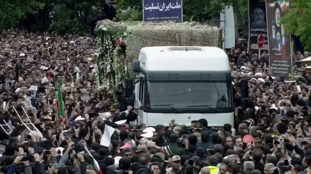 Mourners surround truck carrying remains of Iranian president - NBC News