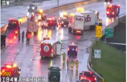 Emergency vehicles responded Tuesday evening to a jack-knifed FedEx box truck that forced a temporary shutdown of Interstate 94 near Little Mack Avenue in Clinton Township. (PHOTO -- MICHIGAN DEPARTMENT OF TRANSPORTATION CAMERA)