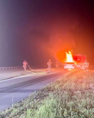 Man in critical condition after sedan lodges under dump truck, catches fire on I-95 - Yahoo! Voices