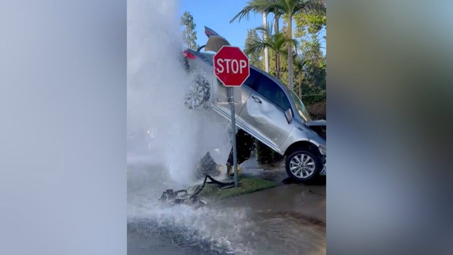 Crash in Orange County leaves car suspended by gushing water - Yahoo! Voices