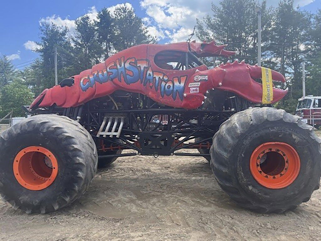 A monster truck clips a power line at a Maine show, toppling utility poles in spectator area - Yahoo! Voices