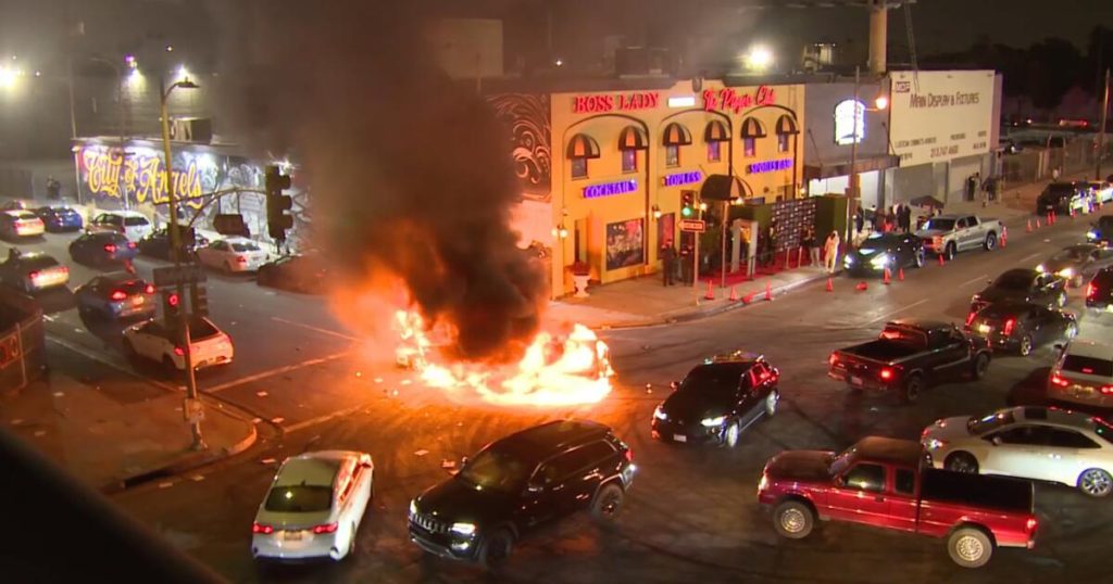 Street takeover in downtown L.A. leaves two cars in flames - Los Angeles Times