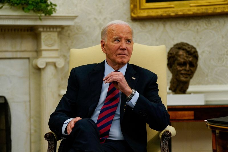 FILE PHOTO: U.S. President Joe Biden reacts to questions from reporters during a meeting with NATO Secretary General Jens Stoltenberg in the Oval Office at the White House in Washington, U.S., June 17, 2024. REUTERS/Elizabeth Frantz/File Photo