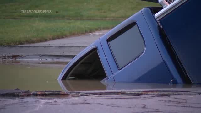 Truck falls into Ohio sinkhole, briefly trapping worker - WANE