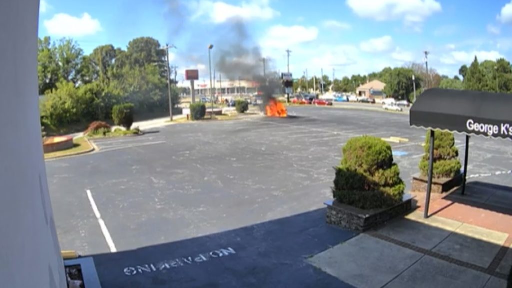 Nearby business captured fiery car crash into an ATM all on camera - WFMYNews2.com