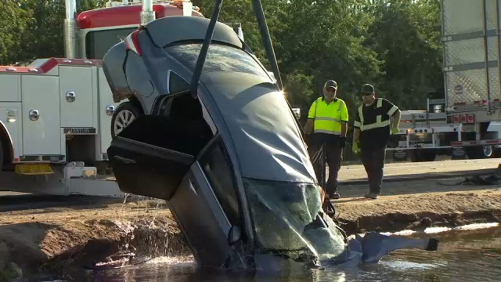 Man's car hit by semi-truck then lands in canal in Fresno County, CHP says - KFSN-TV