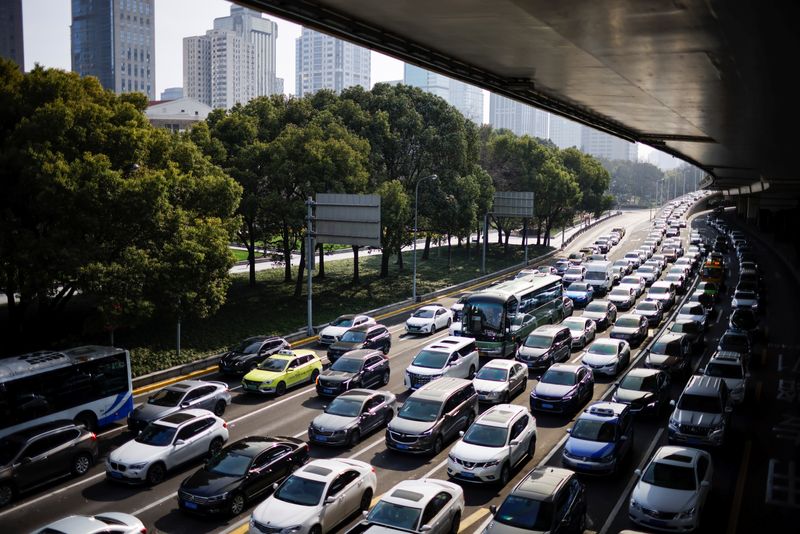 FILE PHOTO: Cars wait in traffic in Shanghai, China March 10, 2021. REUTERS/Aly Song/File Photo